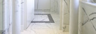 Bathroom Design with White Statuario Marble - Entrance with marble columns.jpg